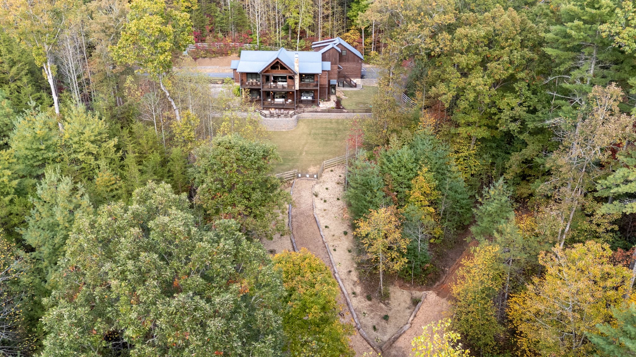 The lodge and its wooded acreage from above